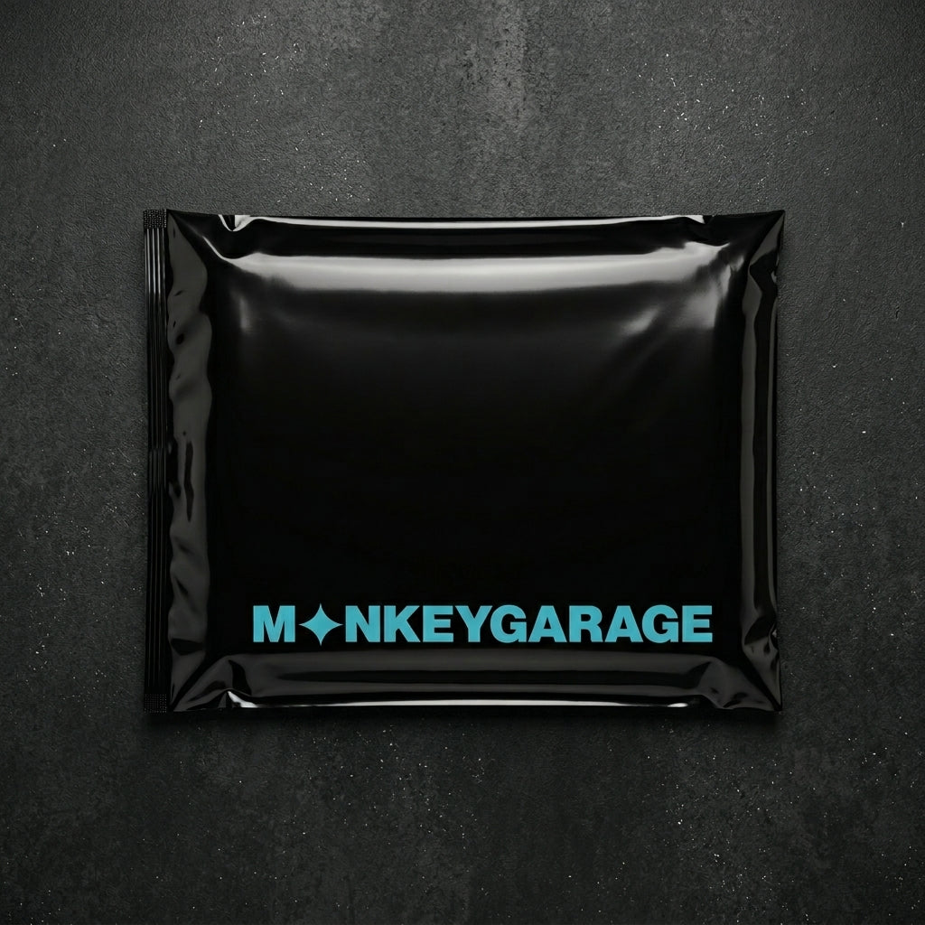 Black packaging with 'MONKEYGARAGE' logo on a dark background inside 1600 gsm greay microfiber cloth 