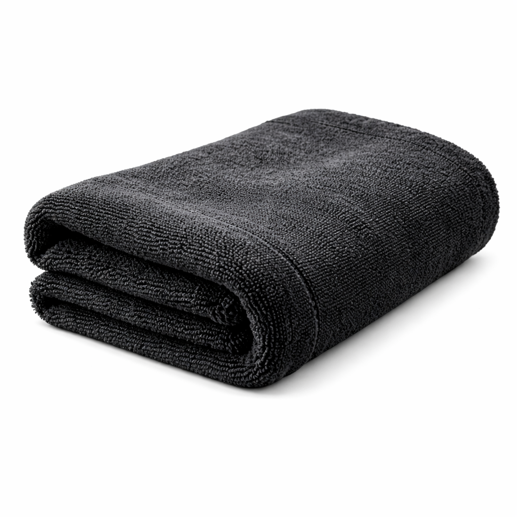 Folded gray microfiber towel on a white background side view
