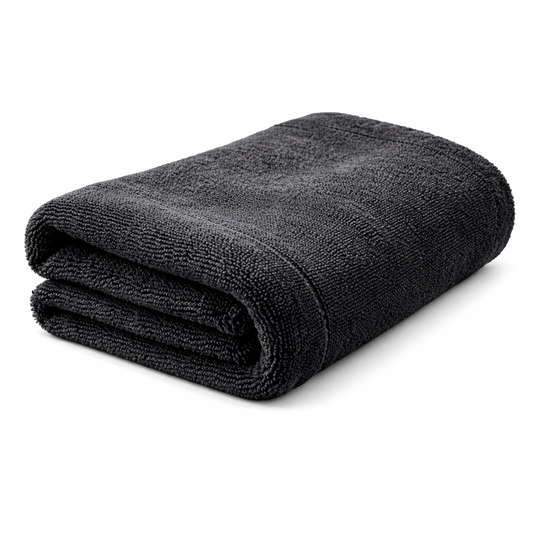 Folded gray microfiber towel on a white background side view