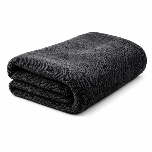 Folded gray microfiber towel on a white background side view