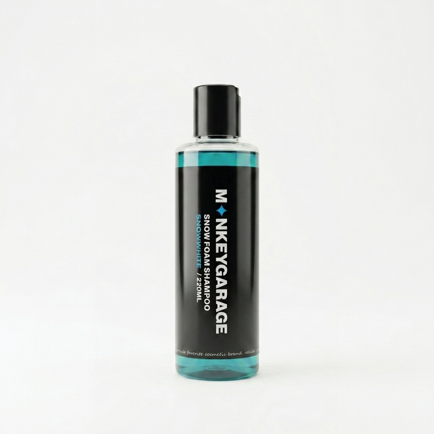 Bottle of Monkey Garage snow foam shampoo on a white background
