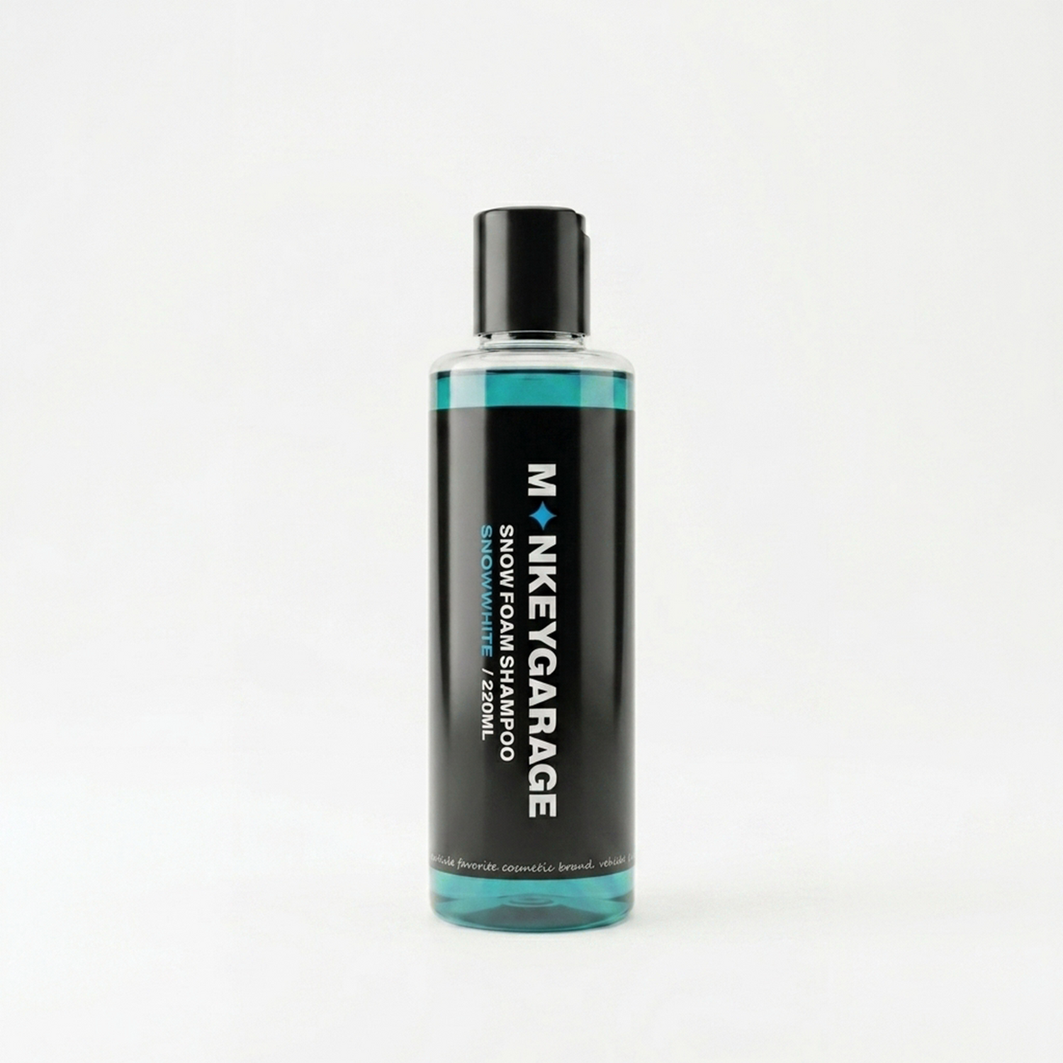 Bottle of Monkey Garage snow foam shampoo on a white background