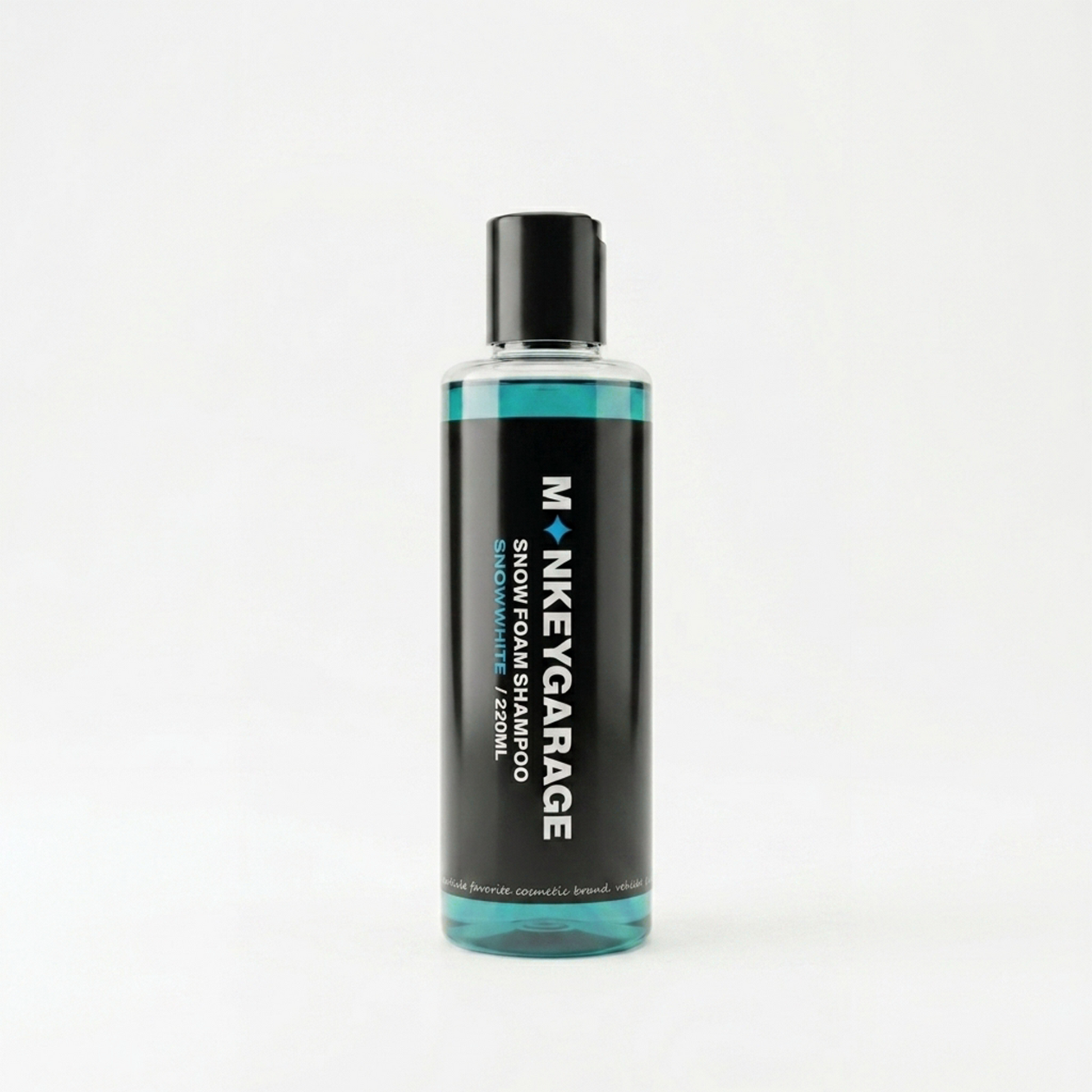 Bottle of Monkey Garage snow foam shampoo on a white background