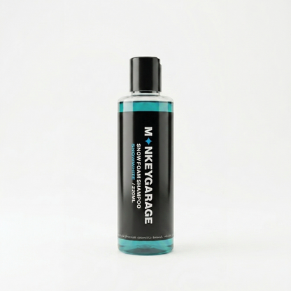 Bottle of Monkey Garage snow foam shampoo on a white background