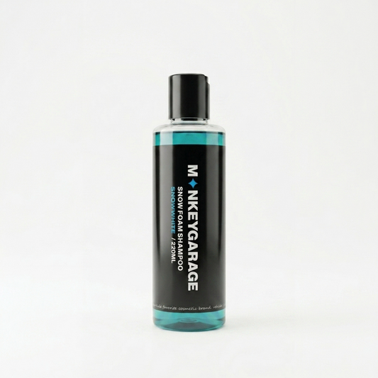 Bottle of Monkey Garage snow foam shampoo on a white background