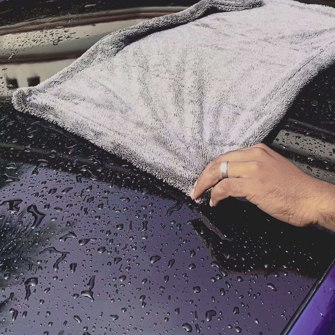 Gray Microfiber cloth Cleaning video on a car top area